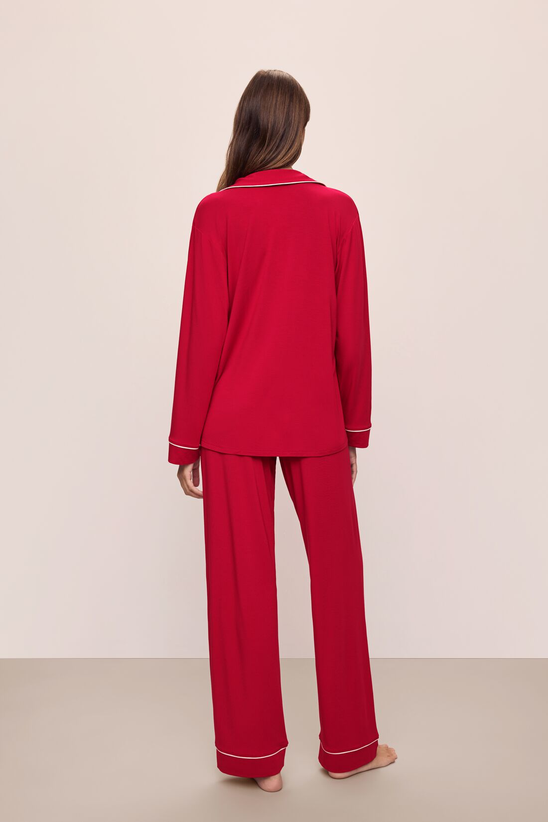 Model wears the Gisele TENCELâ„¢ Modal Long PJ Set in Haute Red/Ivory.