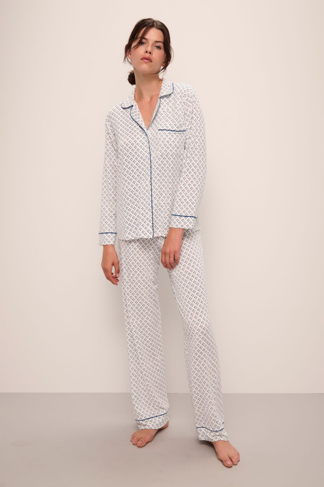 Model wears Gisele Printed TENCELâ„¢ Modal Long PJ Set in Petite Batik Ivory/Denim Blue.