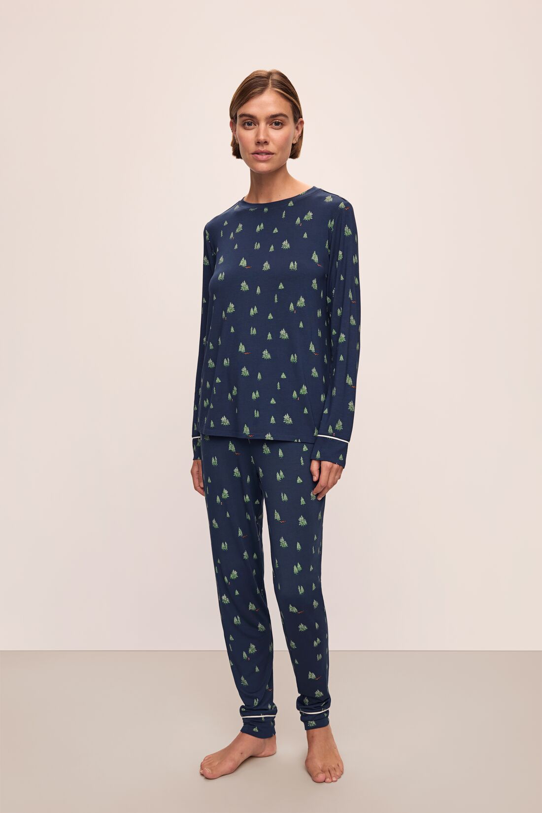 Model wears the Gisele Printed TENCELâ„¢ Modal Crewneck PJ Set in Woodland Pine Navy/Ivory.