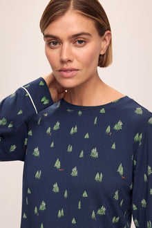 Model wears the Gisele Printed TENCELâ„¢ Modal Crewneck PJ Set in Woodland Pine Navy/Ivory.