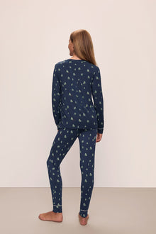 Model wears the Gisele Printed TENCELâ„¢ Modal Crewneck PJ Set in Woodland Pine Navy/Ivory.