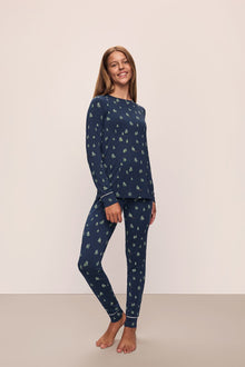 Model wears the Gisele Printed TENCELâ„¢ Modal Crewneck PJ Set in Woodland Pine Navy/Ivory.