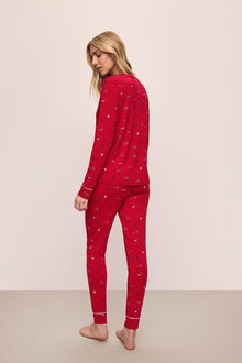 Model wears the Gisele Printed TENCELâ„¢ Modal Crewneck PJ Set in Winter Wonderland Haute Red/Ivory.