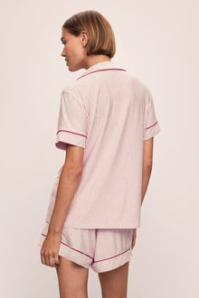 Model wears the Gisele Printed TENCELâ„¢ Modal Relaxed Short PJ Set in Duo Stripe Haute Red/Haute Red.