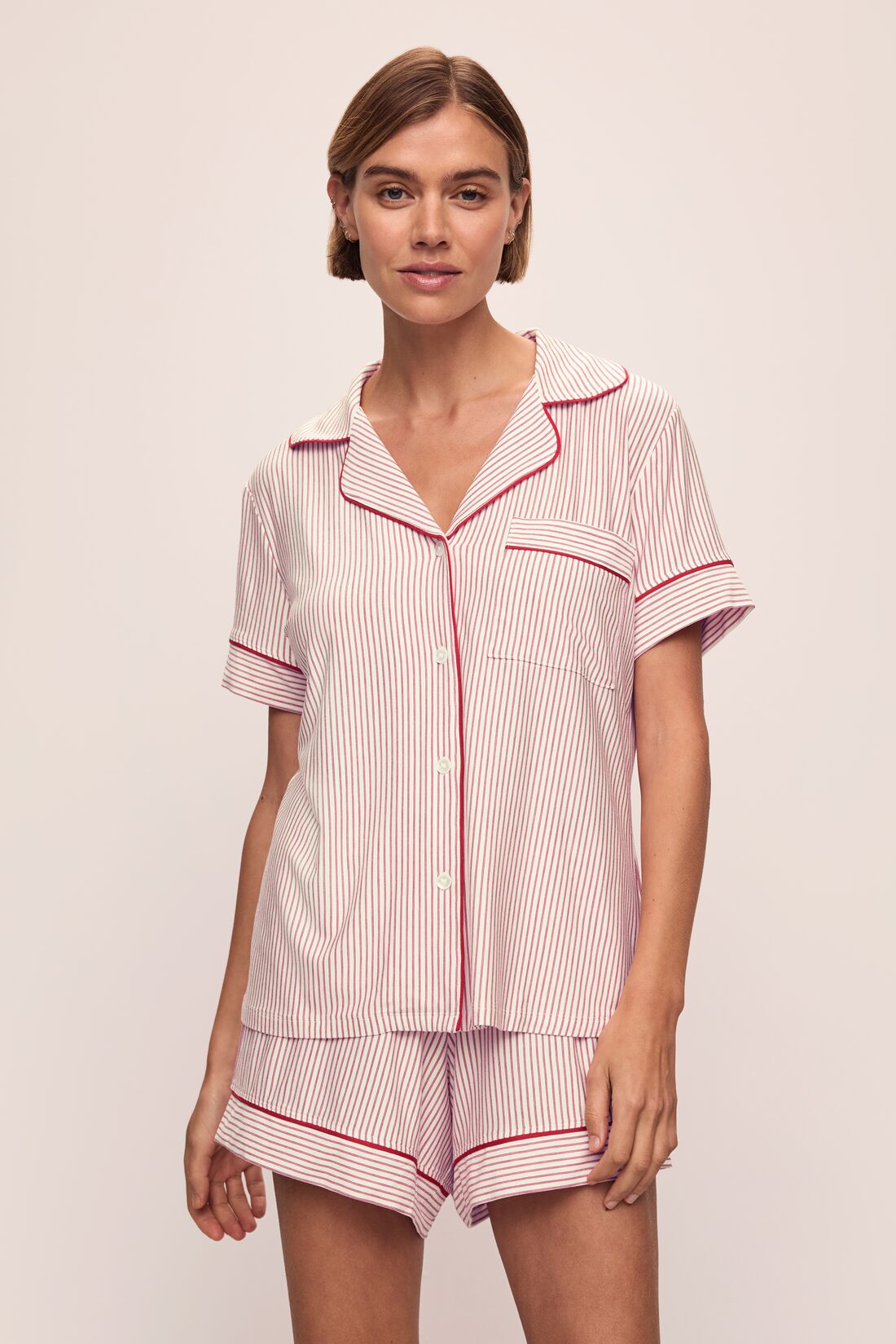 Model wears the Gisele Printed TENCELâ„¢ Modal Relaxed Short PJ Set in Duo Stripe Haute Red/Haute Red.