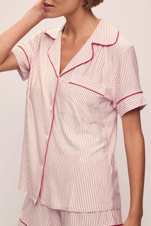 Model wears the Gisele Printed TENCELâ„¢ Modal Relaxed Short PJ Set in Duo Stripe Haute Red/Haute Red.