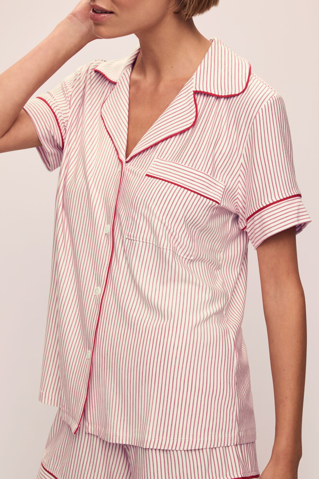 Model wears the Gisele Printed TENCELâ„¢ Modal Relaxed Short PJ Set in Duo Stripe Haute Red/Haute Red.