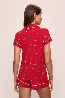 Model wears the Gisele Printed TENCELâ„¢ Modal Shortie Short PJ Set in Winter Wonderland Haute Red/Ivory.
