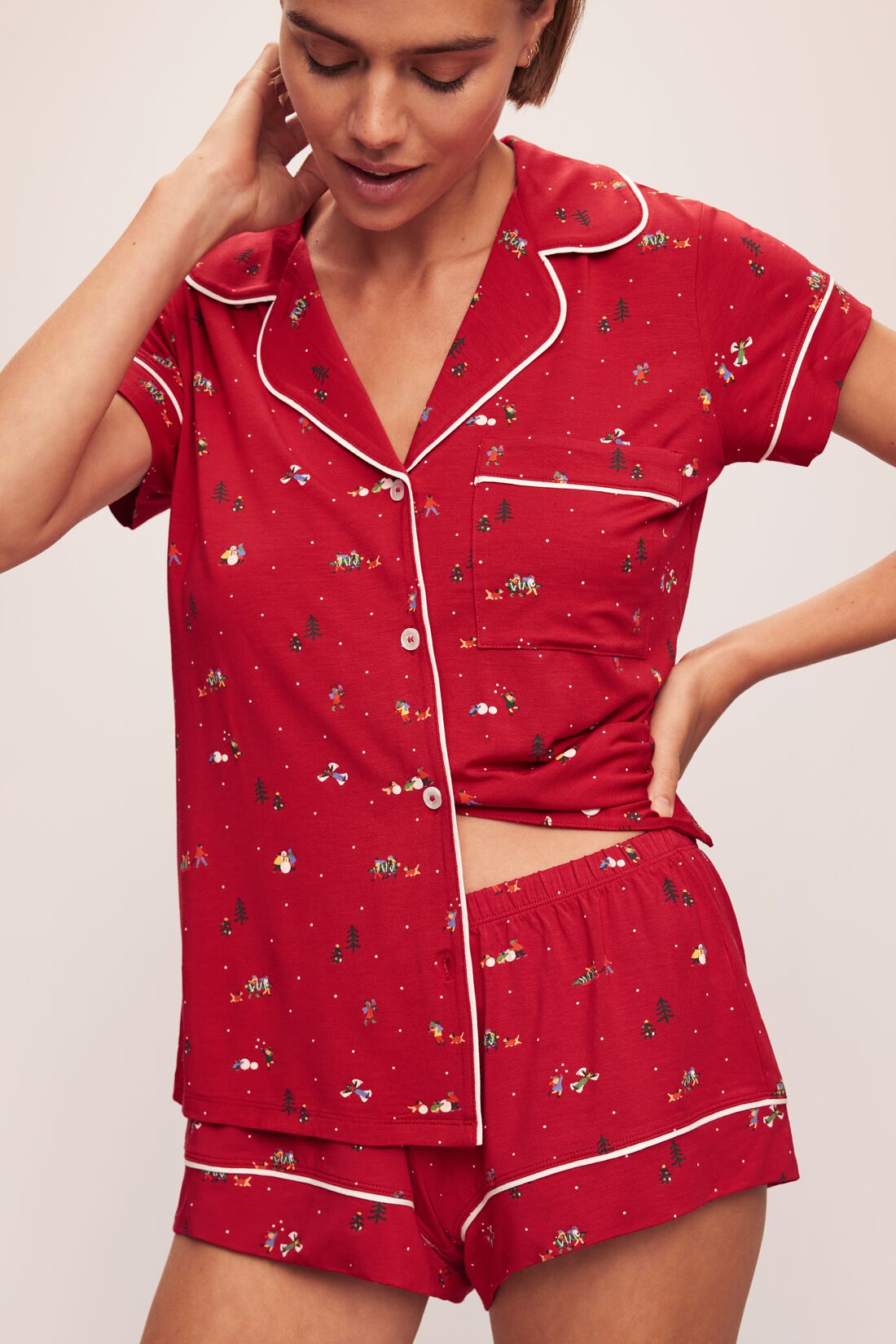 Model wears the Gisele Printed TENCELâ„¢ Modal Shortie Short PJ Set in Winter Wonderland Haute Red/Ivory.