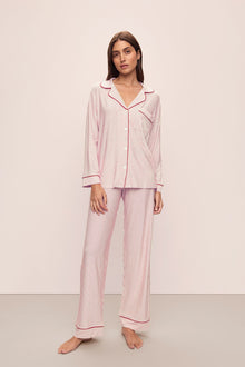 Model wears the Gisele Printed TENCELâ„¢ Modal Long PJ Set in Duo Stripe Haute Red/Haute Red.