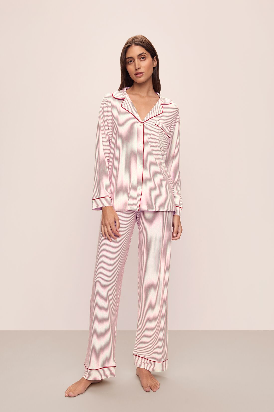 Model wears the Gisele Printed TENCELâ„¢ Modal Long PJ Set in Duo Stripe Haute Red/Haute Red.