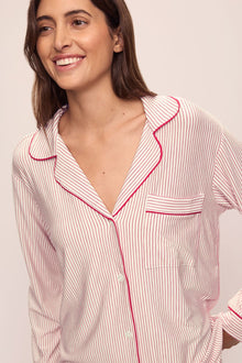 Model wears the Gisele Printed TENCELâ„¢ Modal Long PJ Set in Duo Stripe Haute Red/Haute Red.