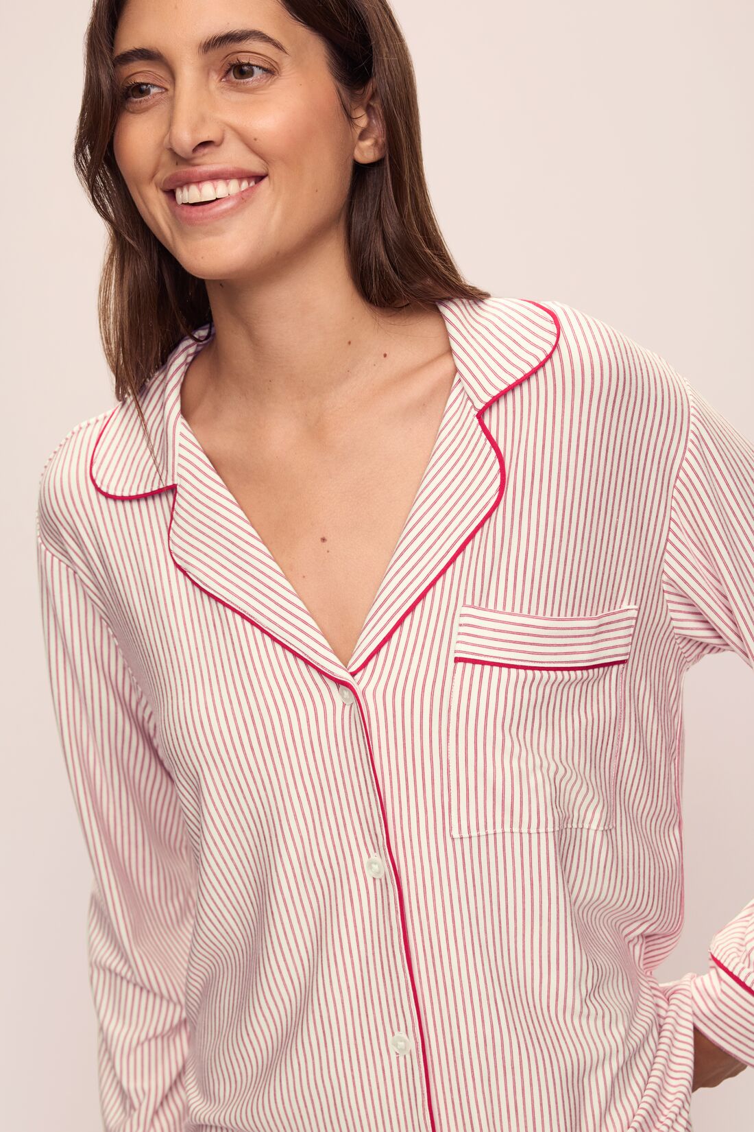 Model wears the Gisele Printed TENCELâ„¢ Modal Long PJ Set in Duo Stripe Haute Red/Haute Red.