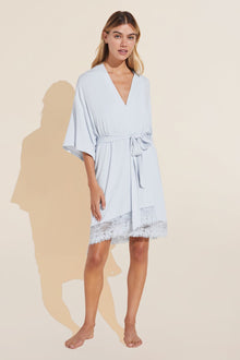 Model wears Rosalia TENCEL™ Modal Robe in ice blue.