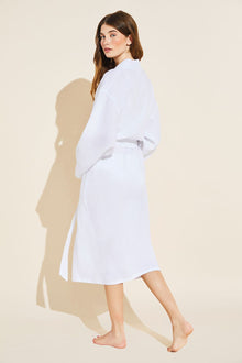 Model wears Long Linen Robe in White.