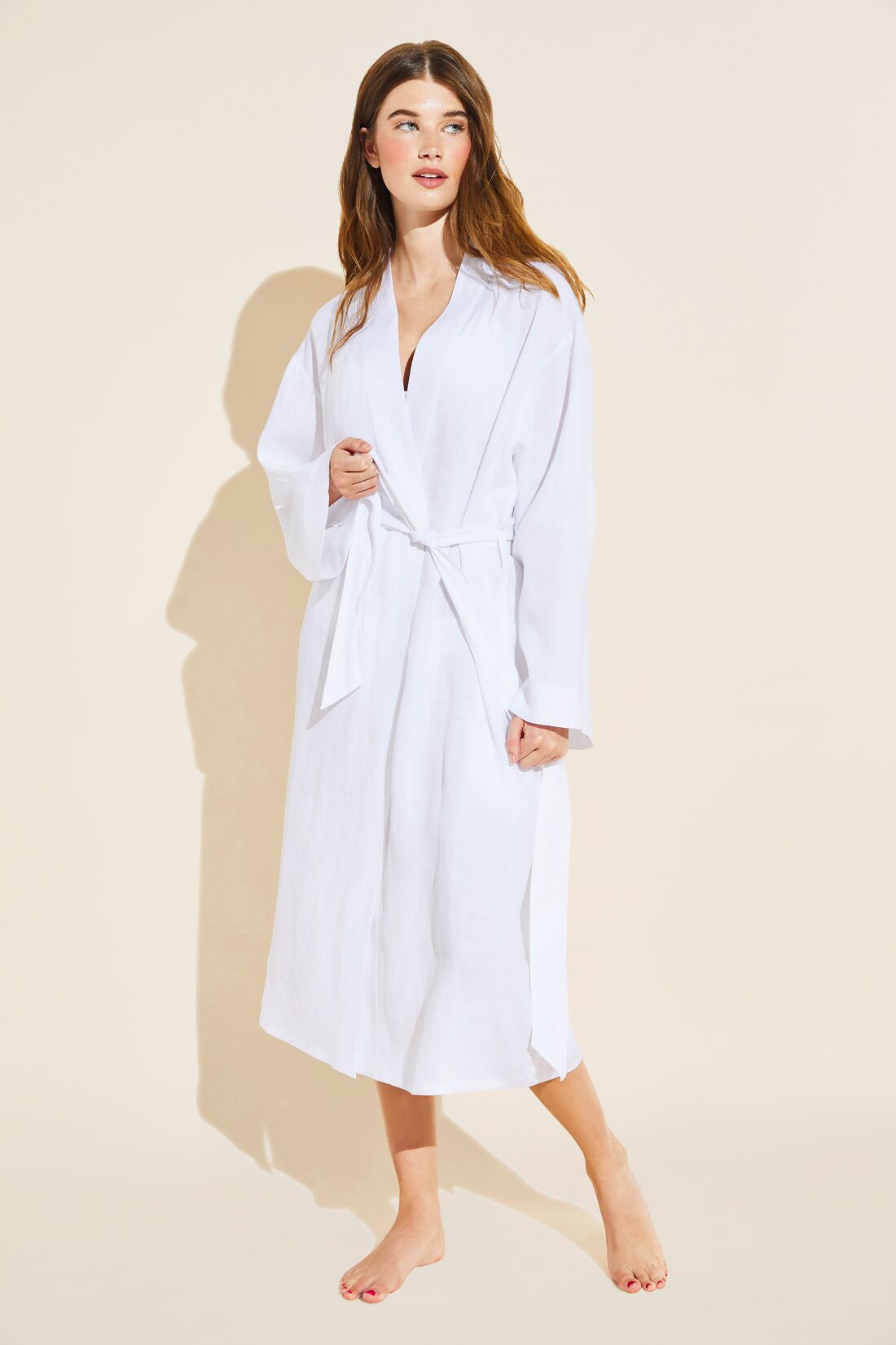 Model wears Long Linen Robe in White.