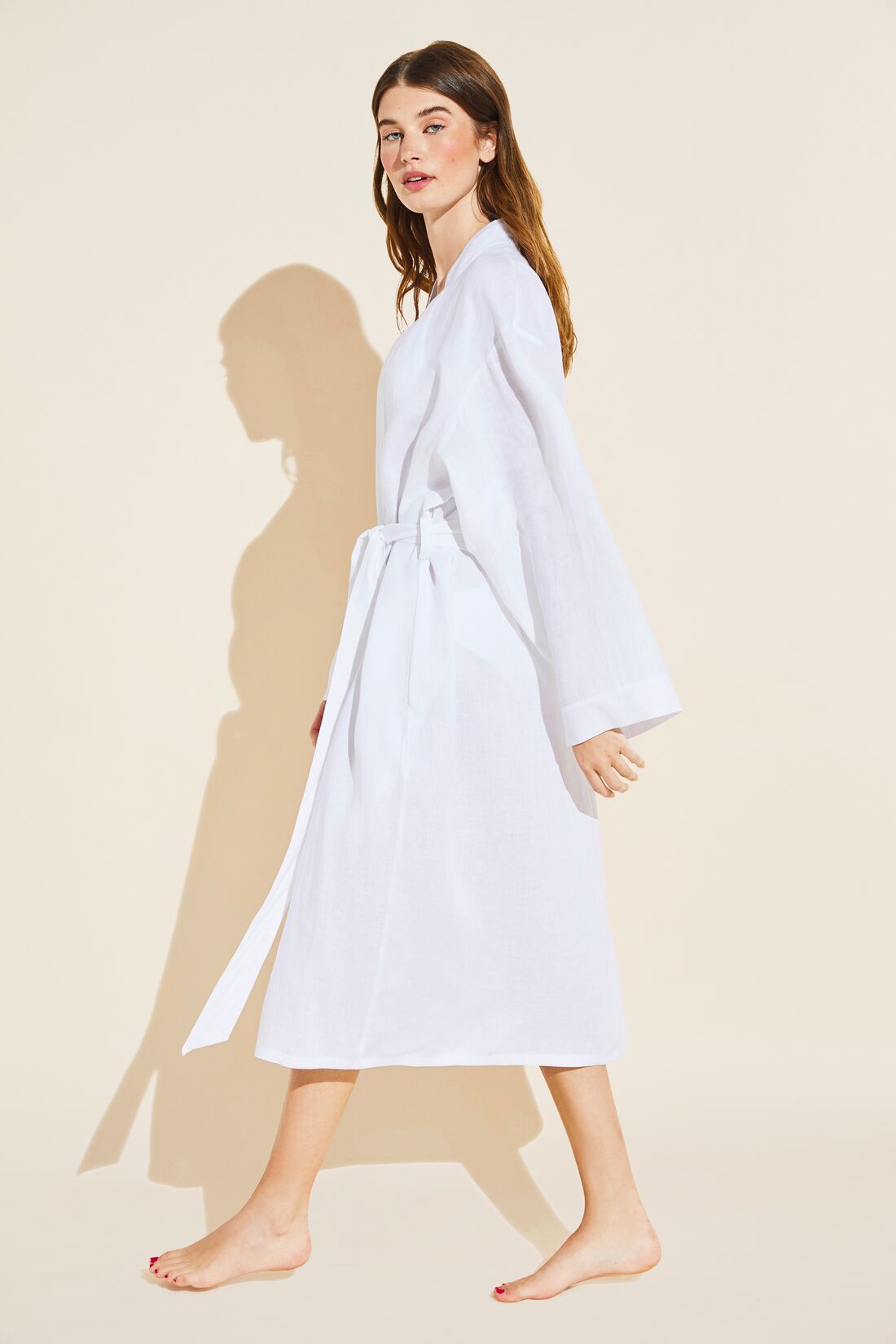 Model wears Long Linen Robe in White.