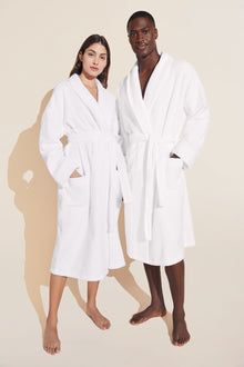 Model wears Terry Gender Neutral Robe in white.