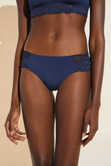 Model wears Rosalia TENCEL™ Modal Bikini in navy.