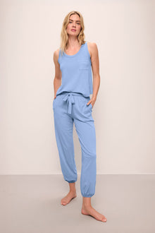 Model wears the Aloe Cotton Pant in Wedgewood Blue.