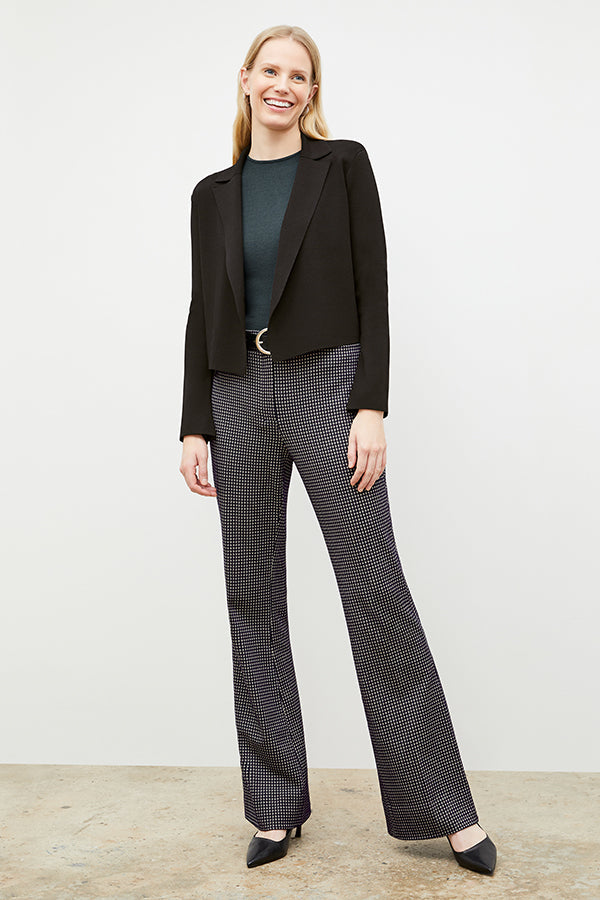 Front image of a woman wearing the horton pant in black and white houndstooth | Exclude