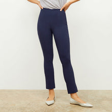 Front image of a woman standing wearing the foster pant in dark navy | Lead