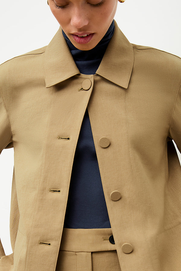 front image of a woman wearing the avelyn jacket in macaroon | Exclude