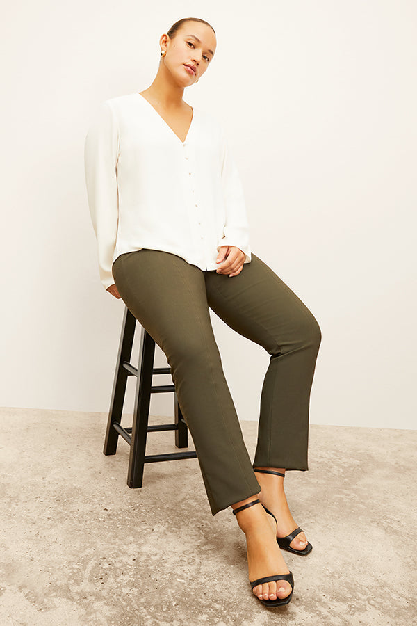 front image of woman wearing foster pant in dark olive | Exclude | Grid Hover