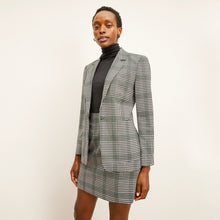 front image of a woman wearing the whitney skirt in check plaid