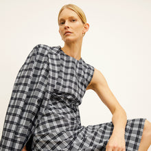 front image of a woman wearing the jeannine dress in checkmate