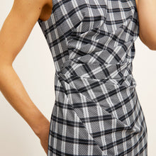 front image of a woman wearing the jeannine dress in checkmate