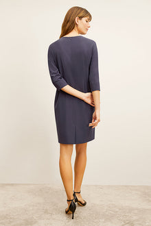 front image of a woman wearing the lancia dress in cool charcoal | Exclude