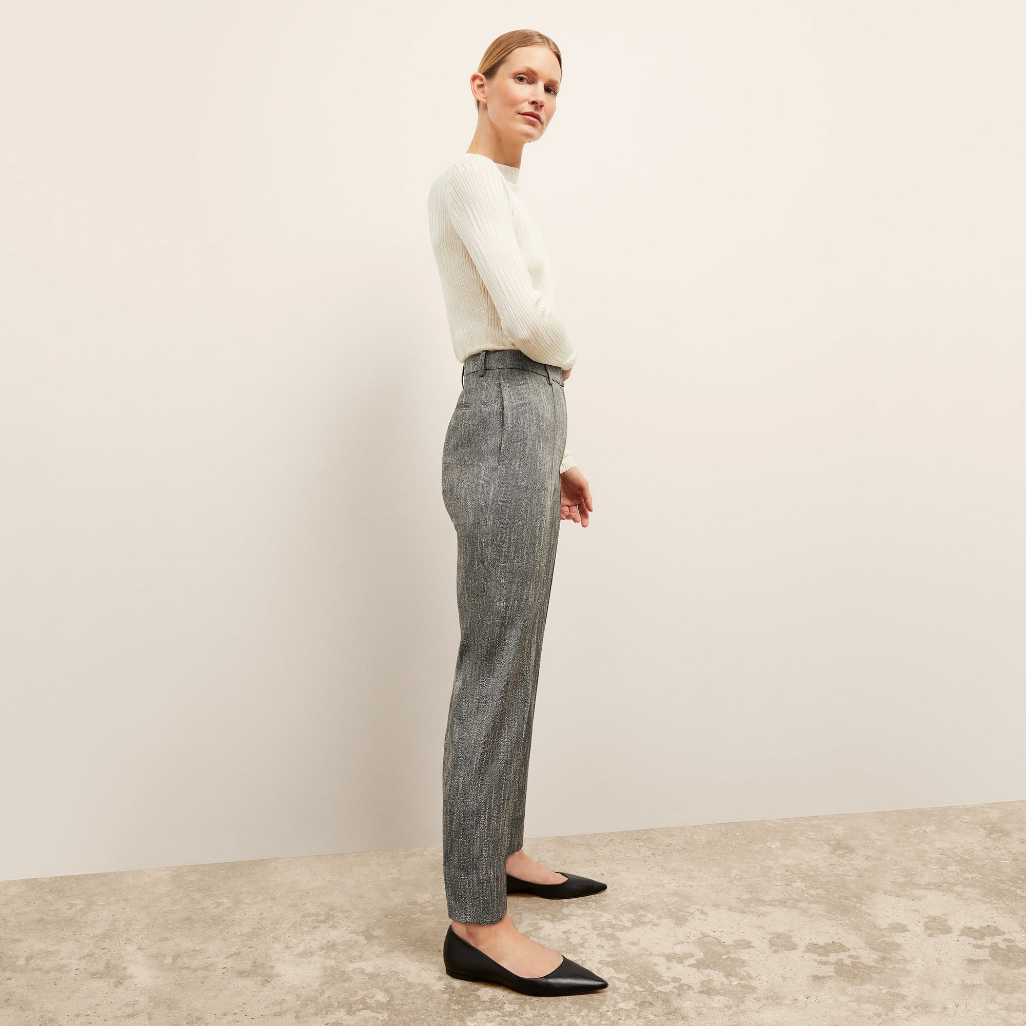 Side image of a woman wearing the brodie top in ivory | Exclude