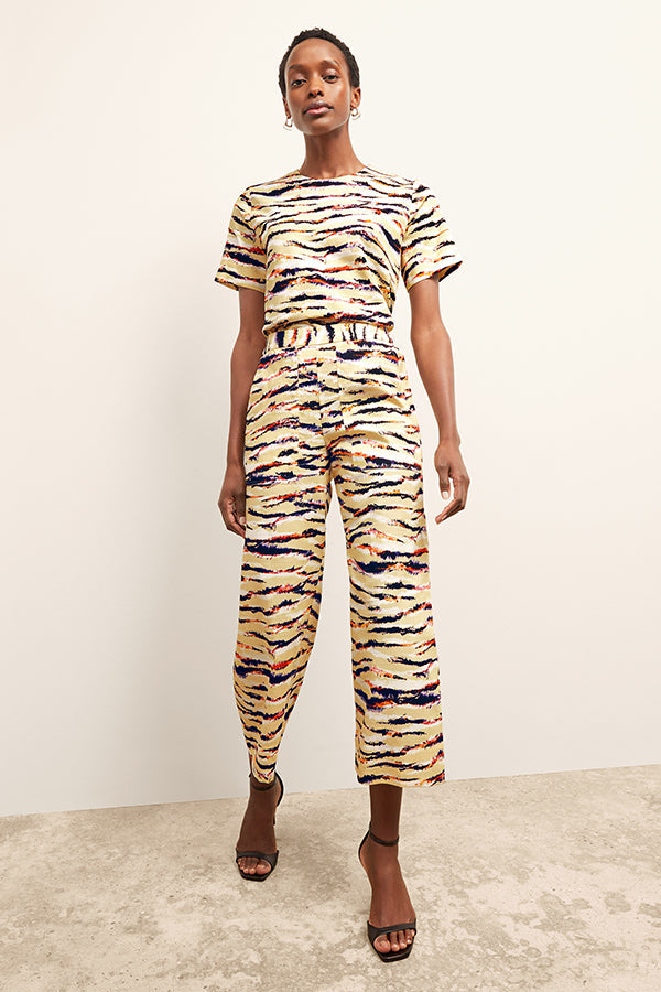 front image of a woman wearing the madelyn pant in savannah print | Exclude