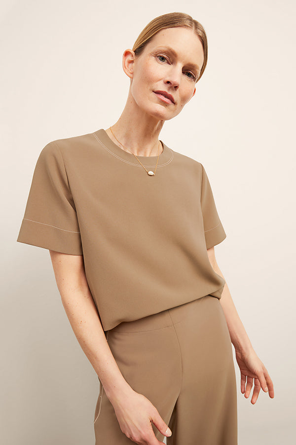 front image of a woman wearing the annika top in saddle | Exclude | Grid