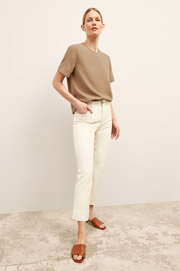 front image of a woman wearing the annika top in saddle | Exclude
