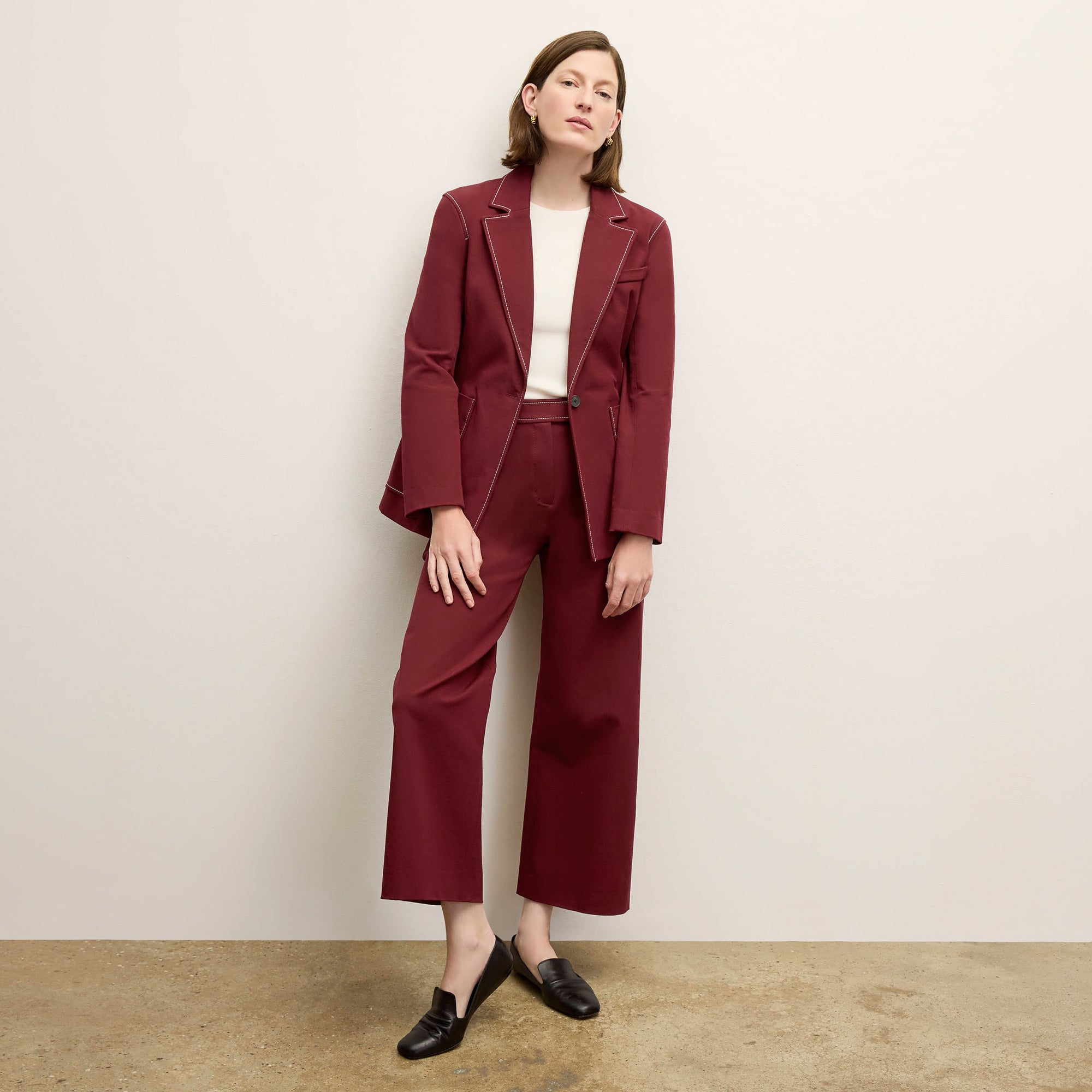 front image of a woman wearing the abby pant in berry jam 
