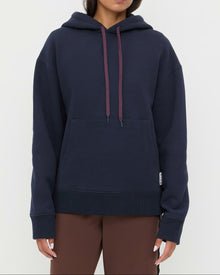 Nova Hoodie in navy cotton and Venus Track Pant in brown cotton.