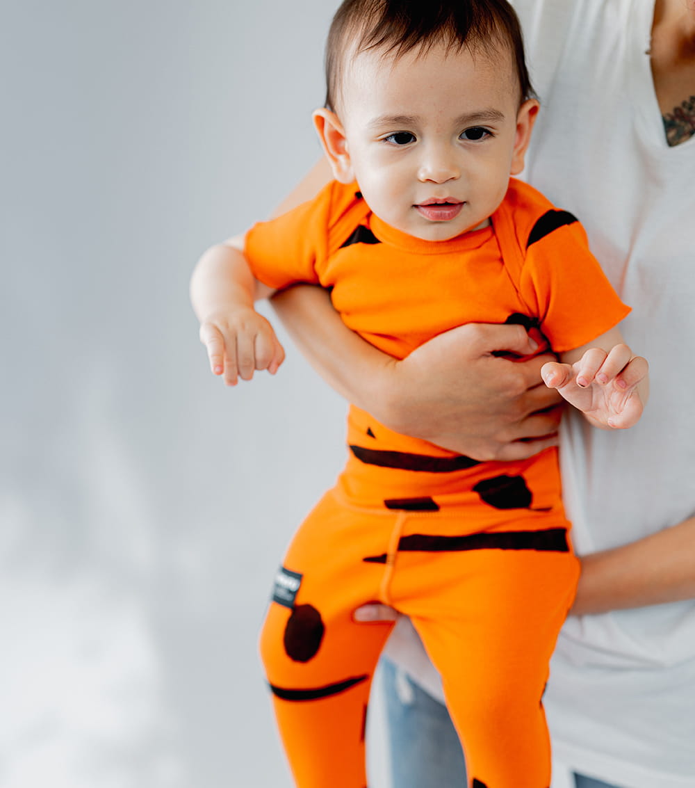 Unisex | Smirks Footed Leggings | Orange Sun