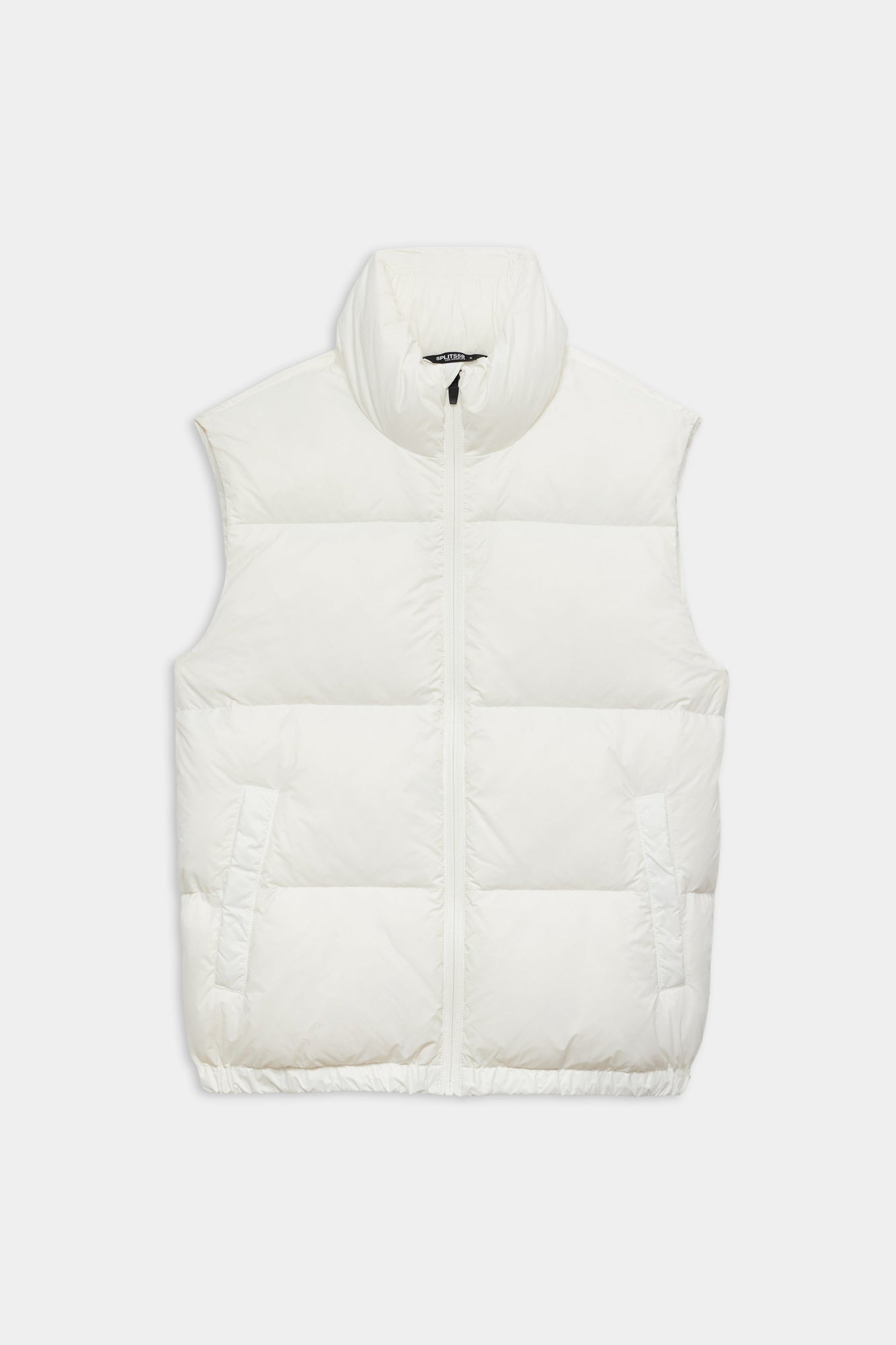 The SPLITS59 Summit Nylon Puffer Vest in white features a sleeveless design, high collar, front zipper closure, and two side pockets for lightweight insulationâ€”ideal for cool weather workouts. Shown laid flat on a white background.
