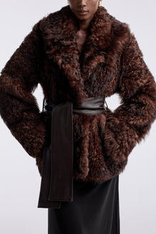 Model is wearing the Nour Hammour Noa Curled Shearling Coat Bourbon - Detail
