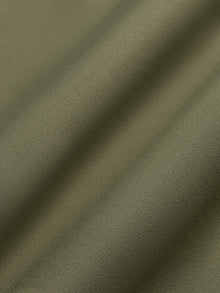 Close-up of olive Diamond Compression fabric texture.