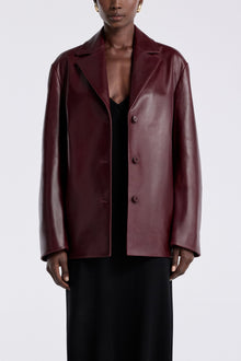 Model is wearing the Nour Hammour Opus Relaxed Leather Blazer Mure - Front Open