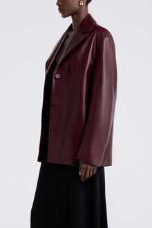 Model is wearing the Nour Hammour Opus Relaxed Leather Blazer Mure - Three Quarters