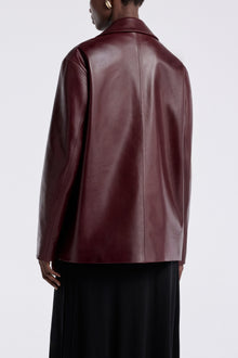 Model is wearing the Nour Hammour Opus Relaxed Leather Blazer Mure - Back