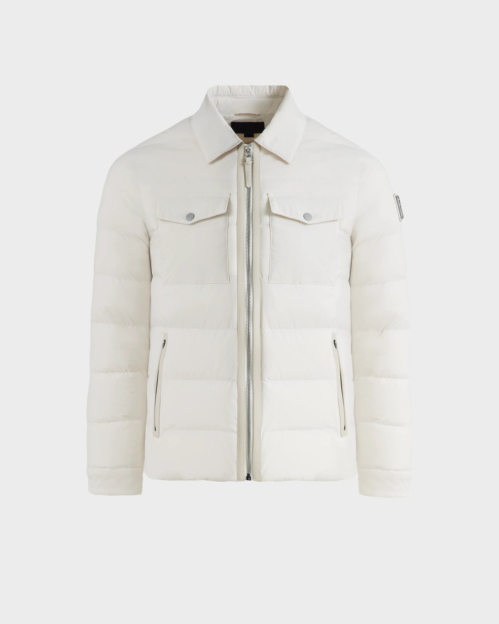 The Rudsak ORNO - 6124601 Vanilla is a mens down quilted jacket with RDS-certified down, a white quilted design, front zipper, two chest flap pockets with buttons, and two zippered side pockets, shown against a plain background.