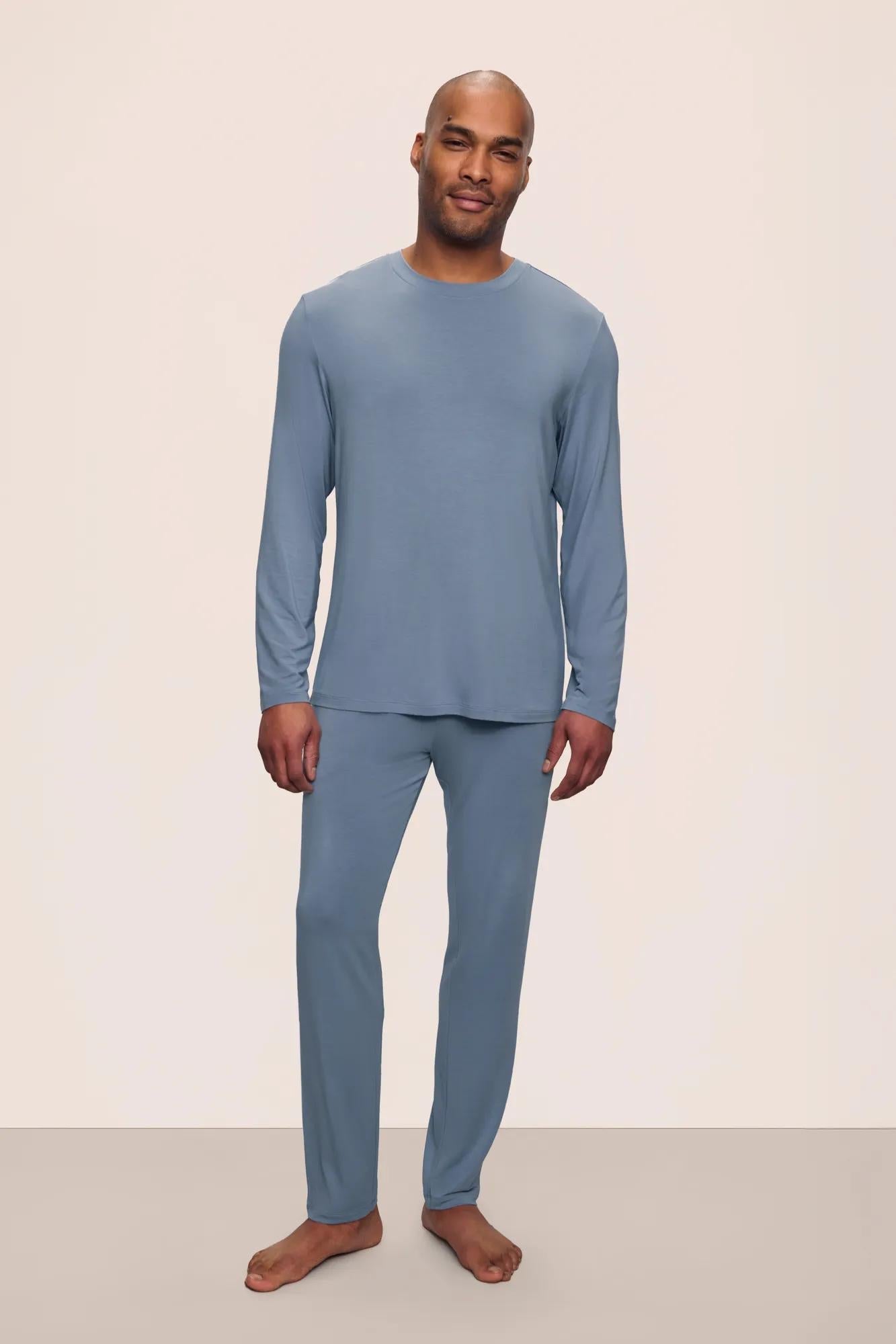 Model is wearing Henry TENCEL Modal Long Sleeve Crew PJ Set in Faded Denim