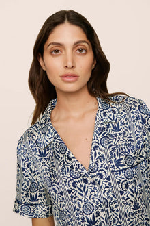 Model is wearing Inez Washable Silk Printed Short PJ Set in  Azulejos Navy/Navy