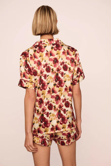 Model is wearing Inez Washable Silk Printed Short PJ Set in Botanical Flower Merlot/Merlot