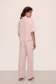Model is wearing Nautico Relaxed Short Sleeve & Pant PJ Set in  Feeder Stripes Pale Mauve/White